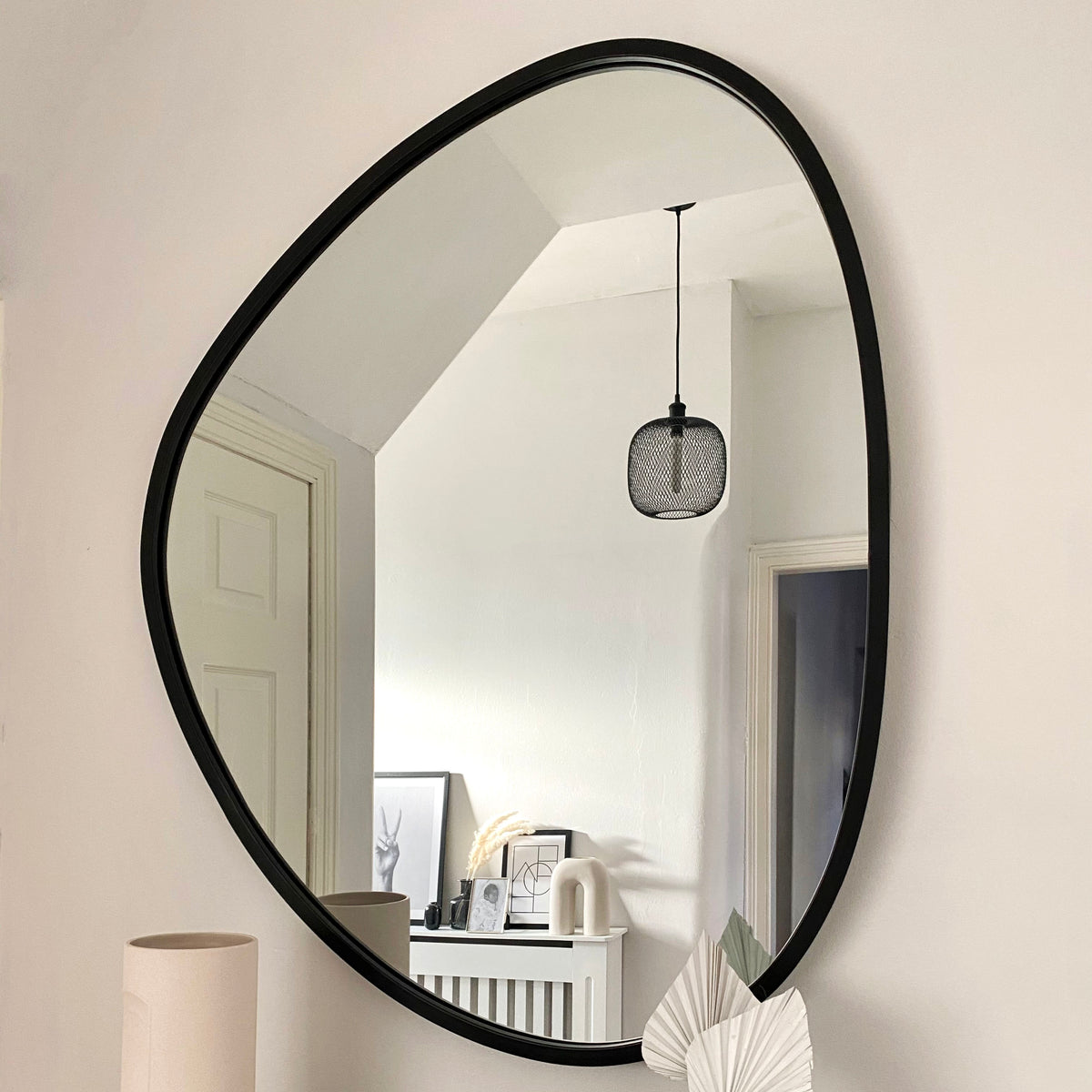 Large Black Irregular Metal Wall Mirror in living room