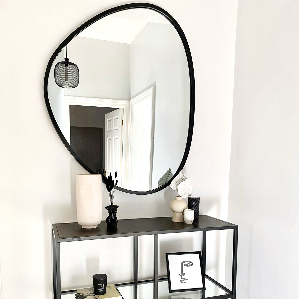 Large Black Irregular Metal Wall Mirror above console table