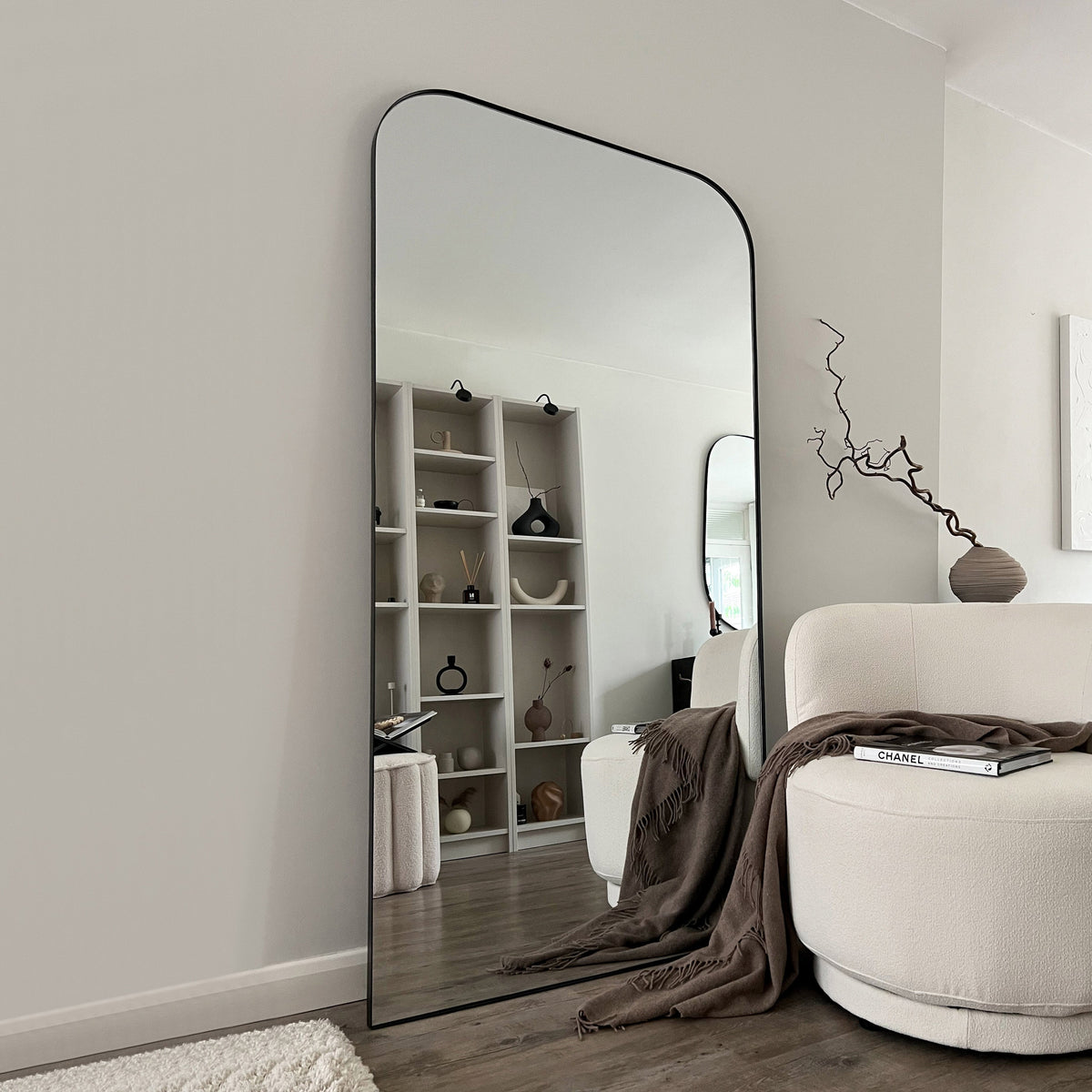 Full Length Black Curved Large Metal Mirror as a living room lean to