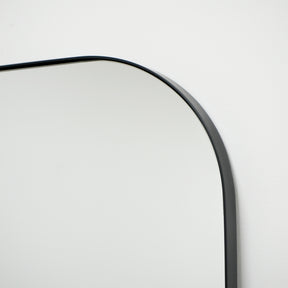 Detail shot of Full Length Black Curved Large Metal Mirror arch