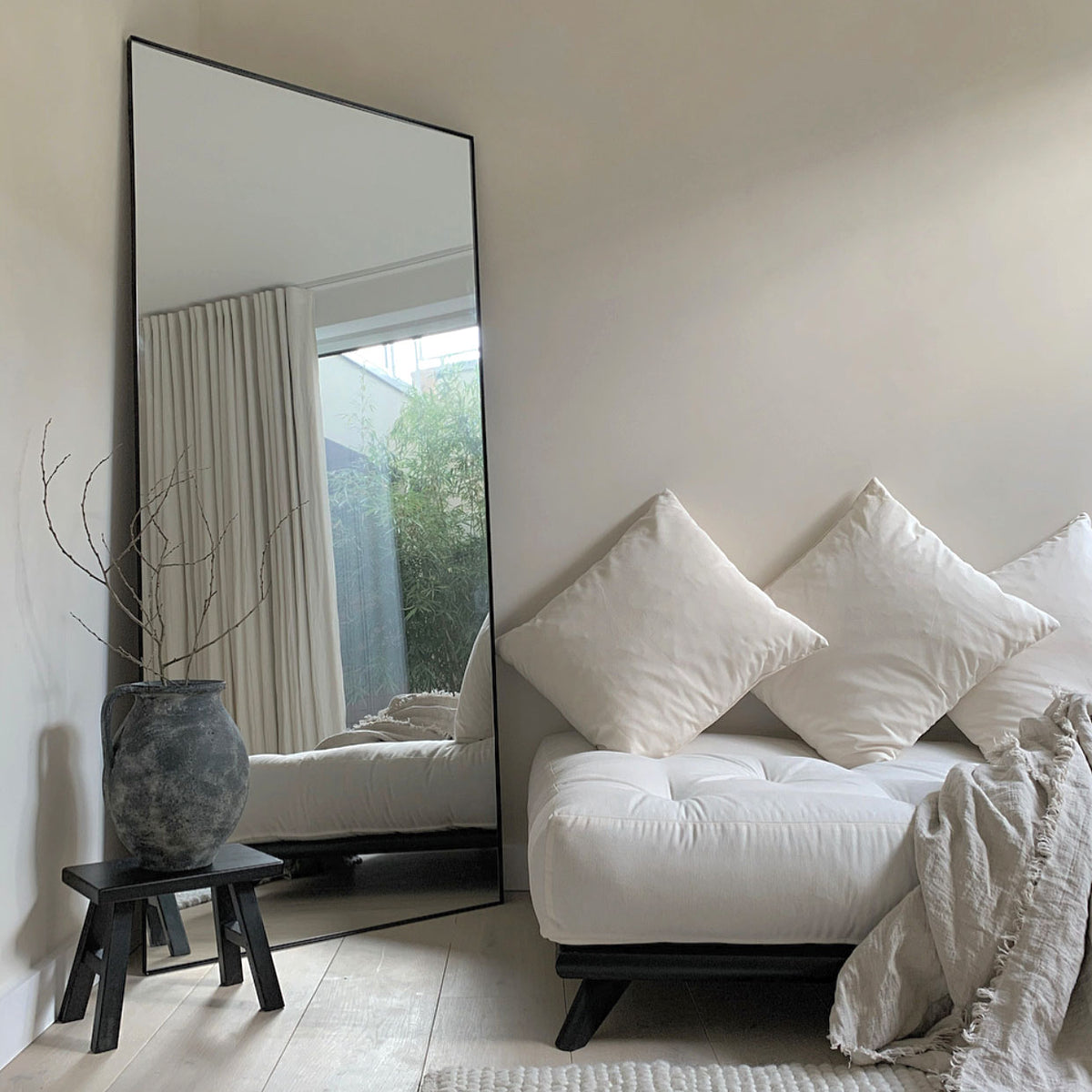 Full Length Black Rectangular Large Metal Mirror beside sofa