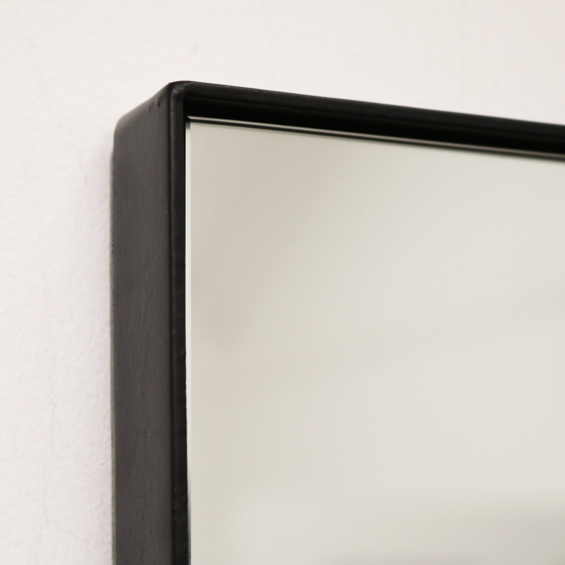 Detail shot of Black Rectangular Metal Wall Mirror corner