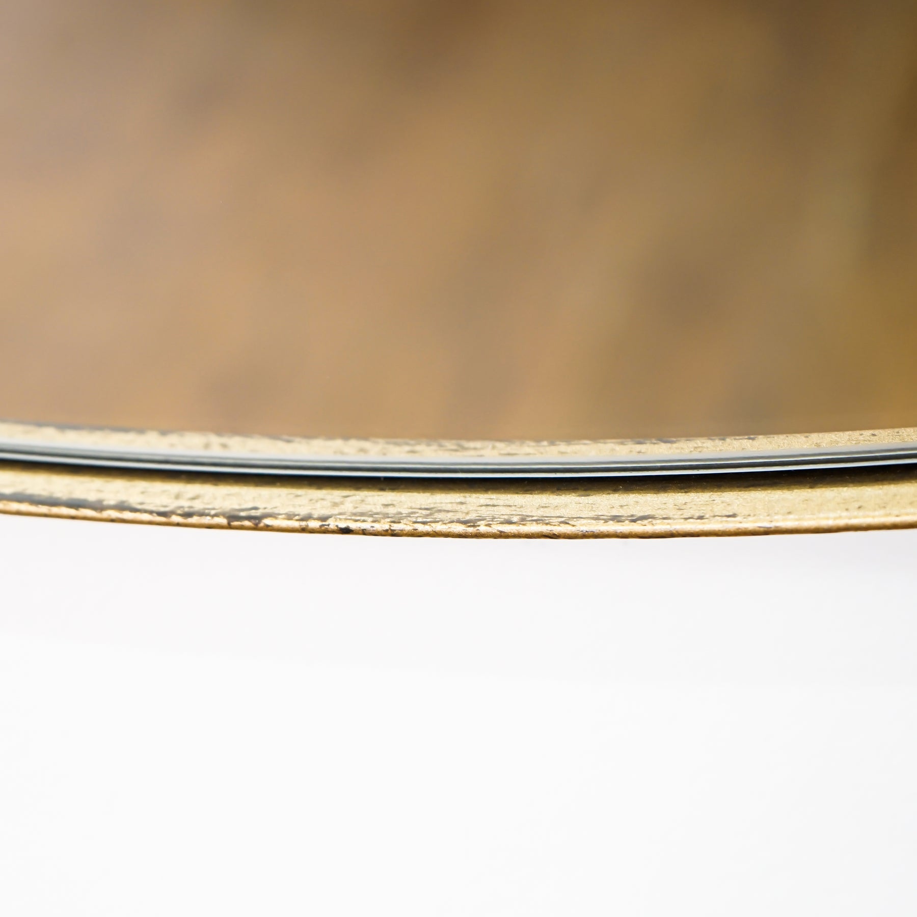 Detail shot of Gold Round Metal Extra Large Wall Mirror frame texture
