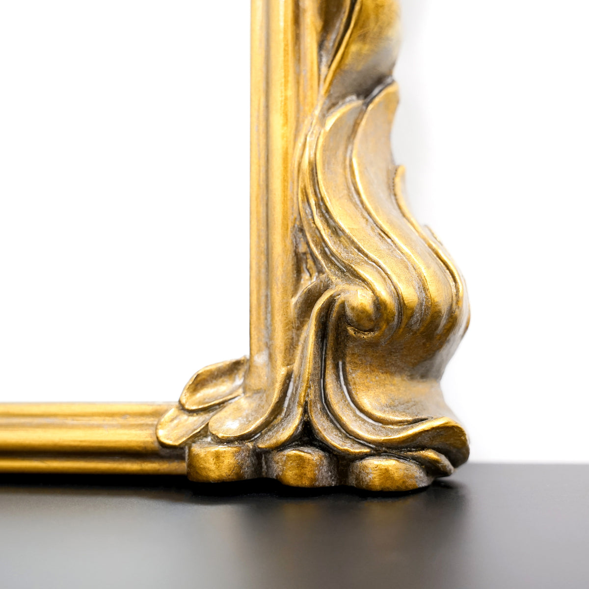 Detail shot of Gold Arched Metal Overmantle Mirror frame design