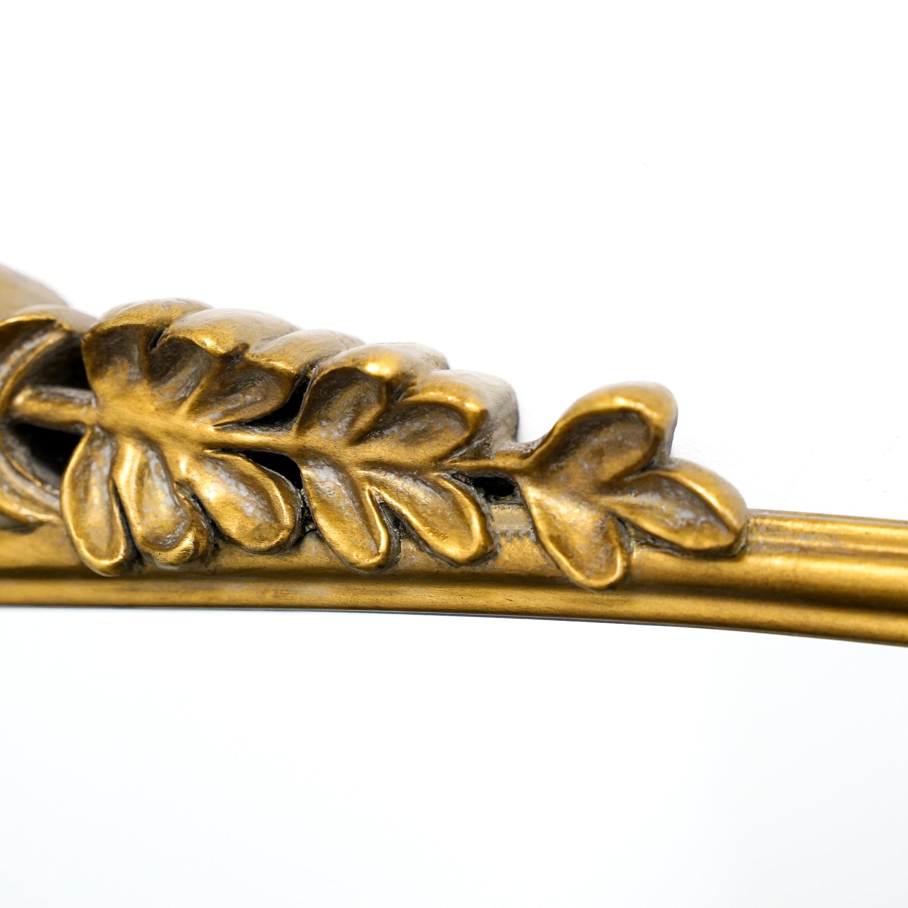 Detail shot of Gold Arched Metal Overmantle Mirror top crest