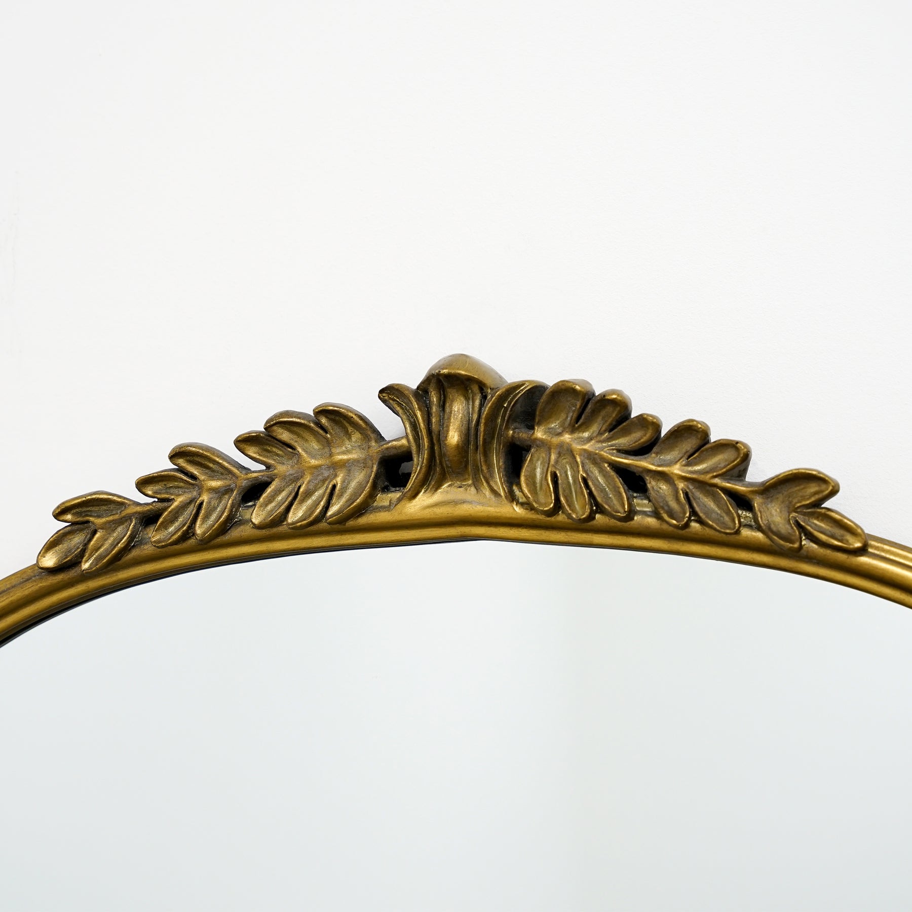 Detail shot of Full Length Gold Arched Ornate Metal Mirror top crest