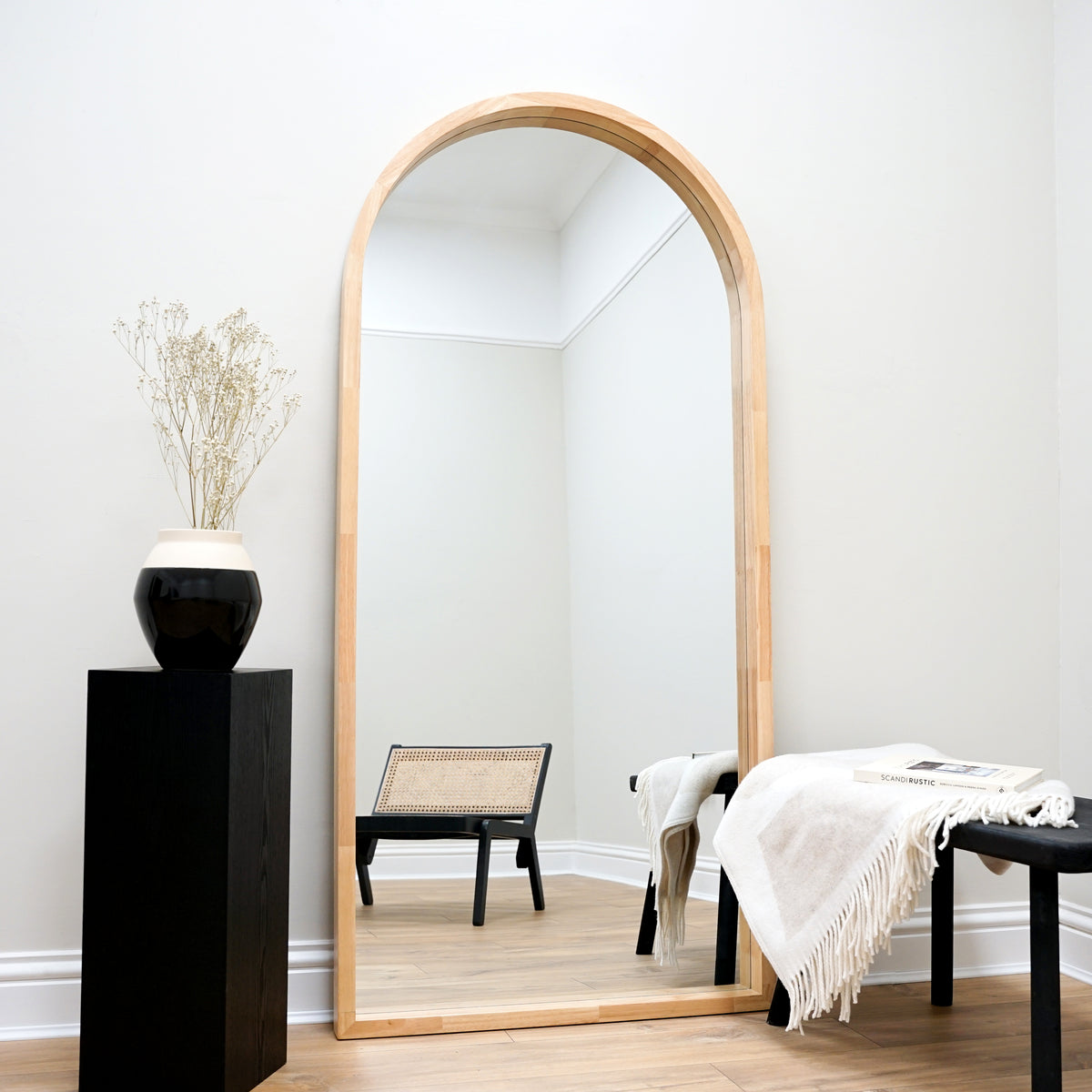 Natural Organic Full Length Wooden Arched Mirror beside pedestal