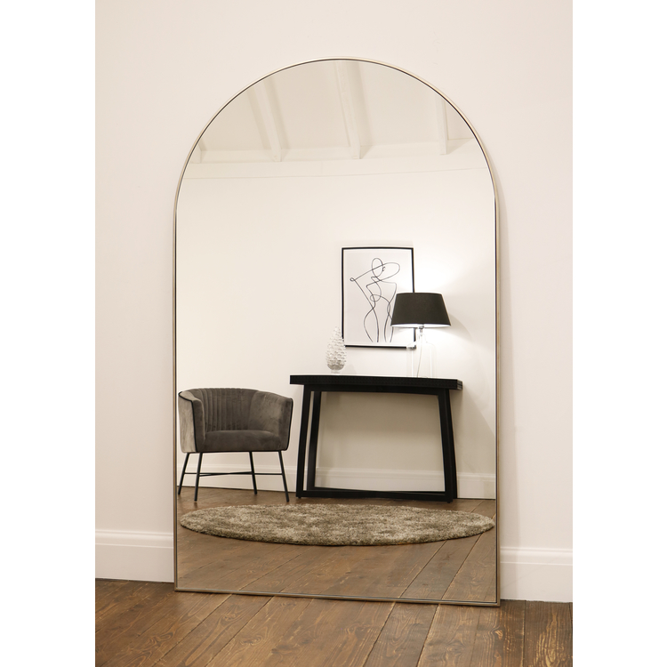 Champagne Full Length Arched Metal Mirror reflecting lounge
