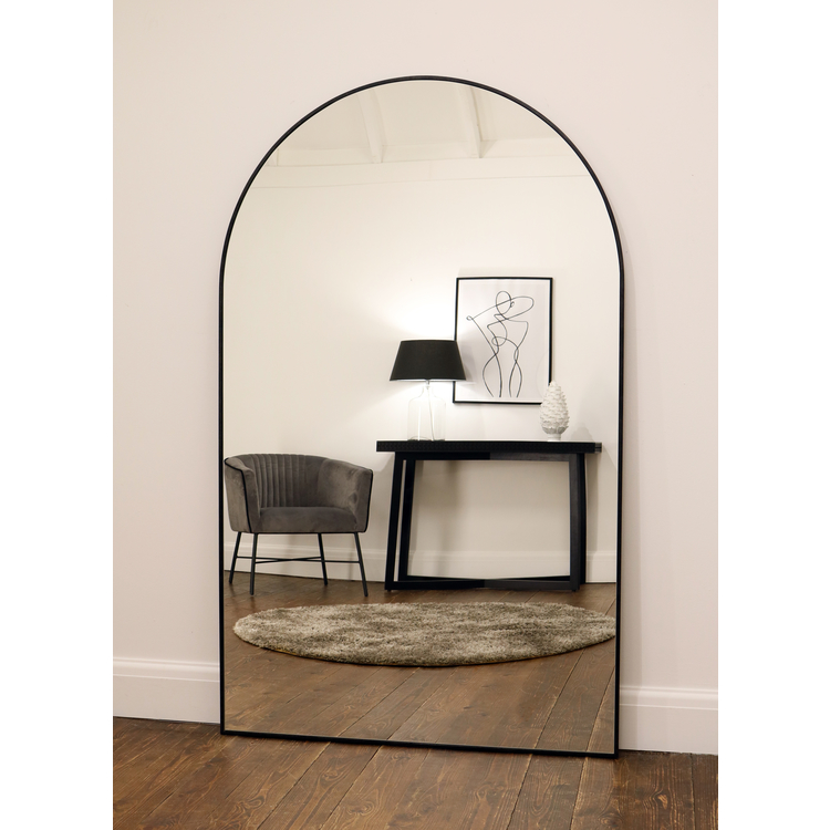 Black Full Length Arched Metal Mirror reflecting lounge