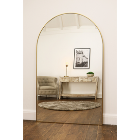 Gold Full Length Arched Metal Mirror as a lounge lean to