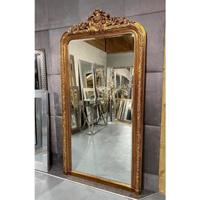 Full Length Gold Ornate Mirror standing out among other mirrrors