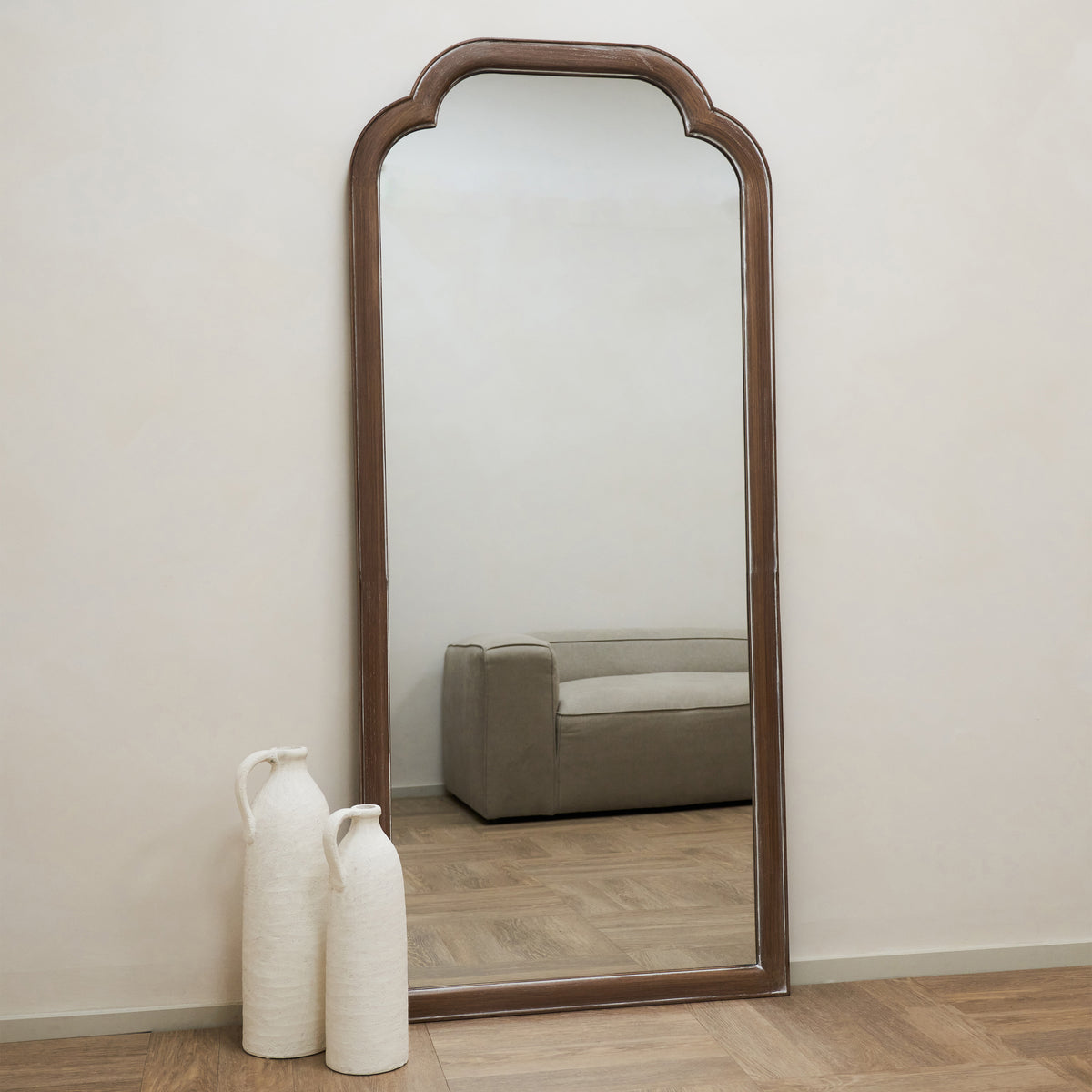 Full Length Washed Wood Arched Mirror beside ceramics