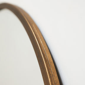 Gold Metal Modern Round Wall Mirror closeup of curves