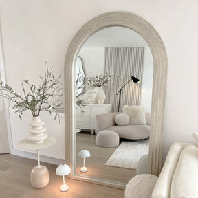 Full Length Arched Concrete Mirror leaning against wall in lounge