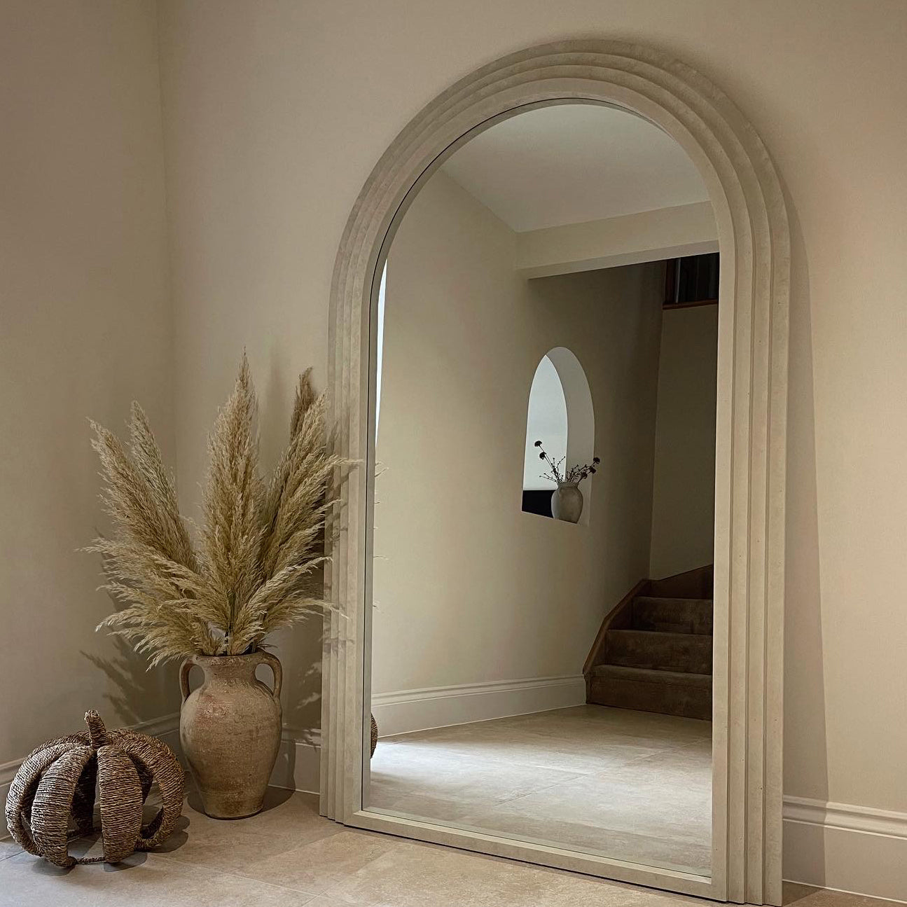 Full Length Arched Concrete Mirror opposite staircase