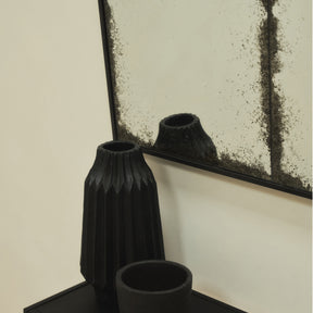 Black Antique Glass Metal Console Mirror above ceramic vases