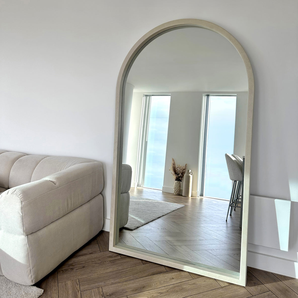 Full Length Extra Large Arched Concrete Mirror beside sofa