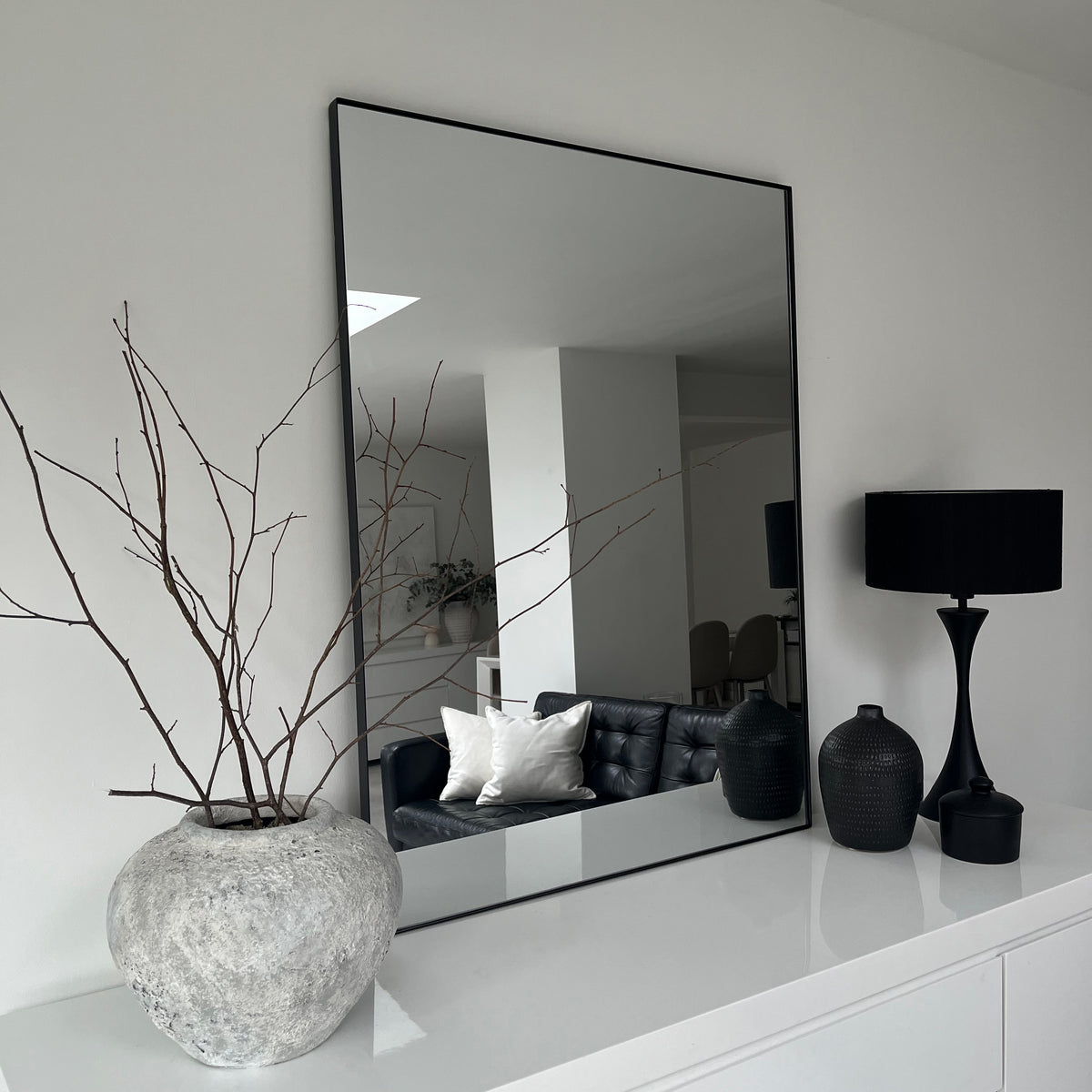 Black Rectangular Metal Large Wall Mirror on console table