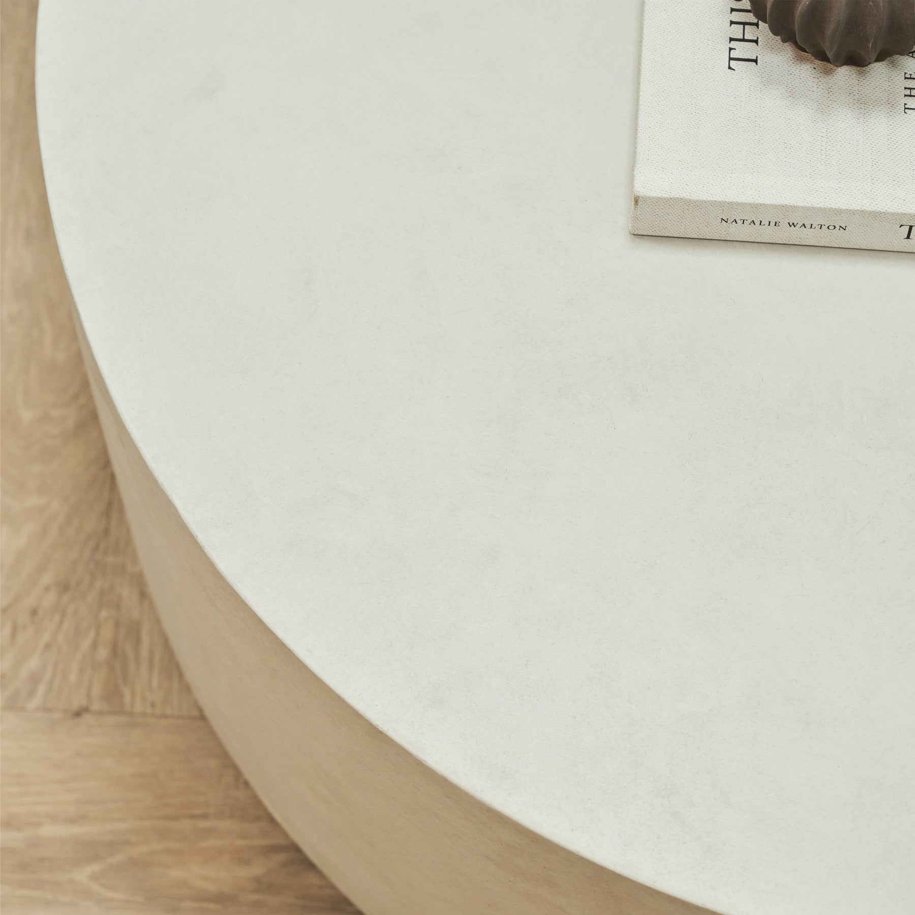 Closeup of Large minimalist concrete round coffee table