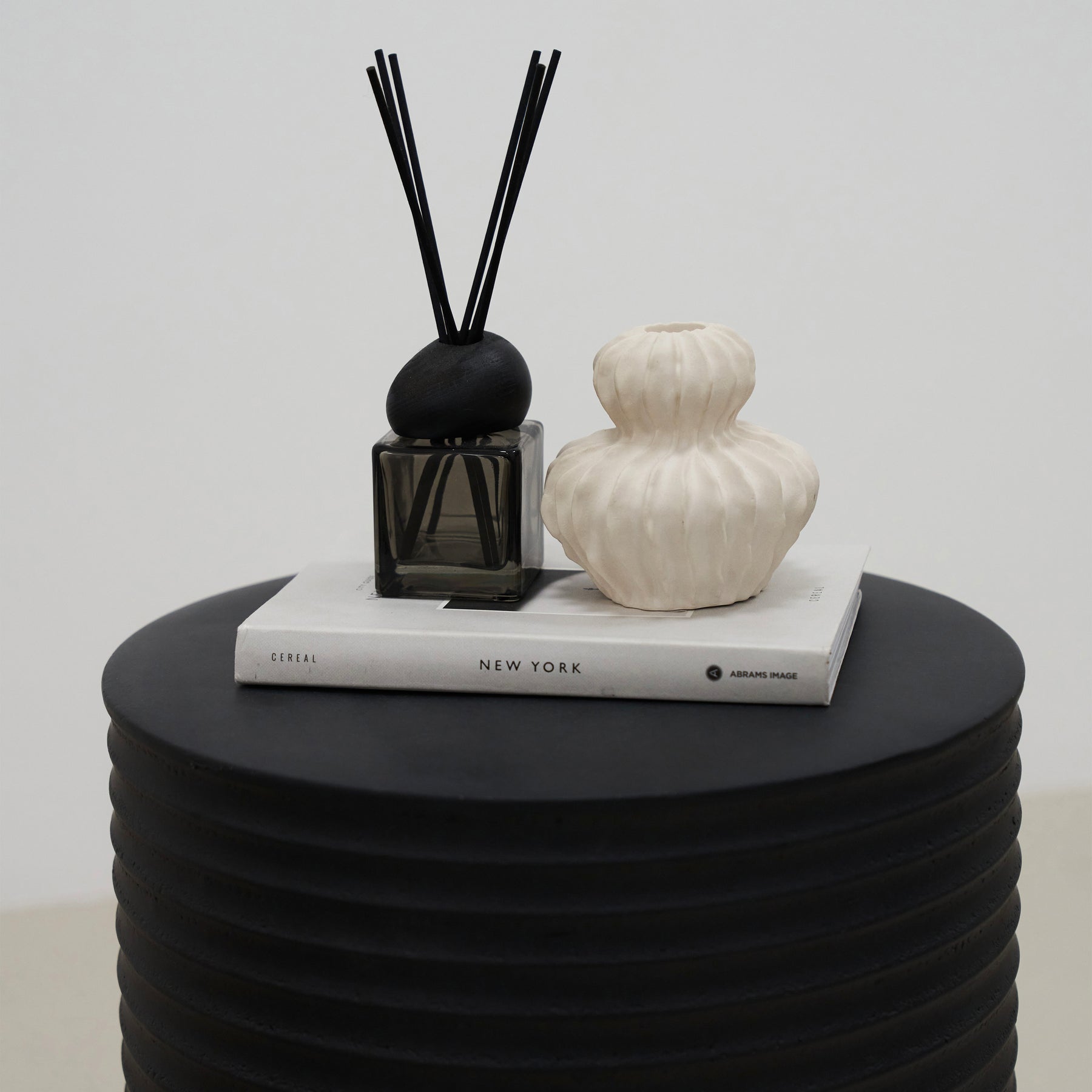 detail shot of Minimal Onyx Ribbed Side Table's ornaments