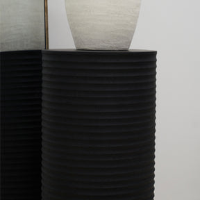 Minimal Onyx Ribbed Plinth and vase beside mirror