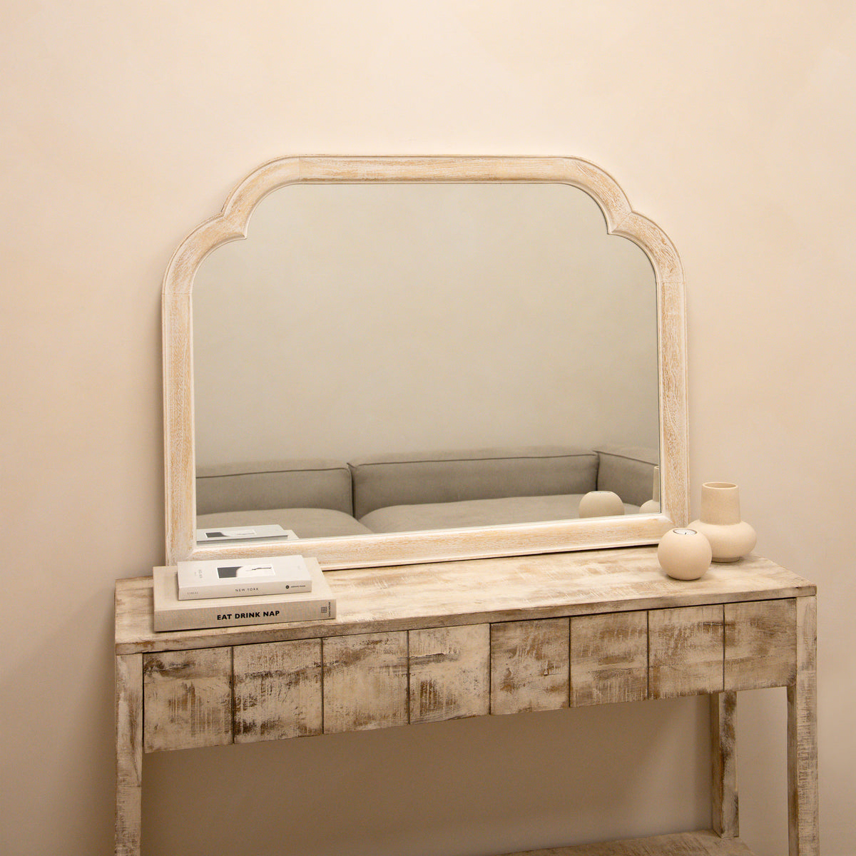 White Washed Wood Arched Overmantle Mirror atop console table
