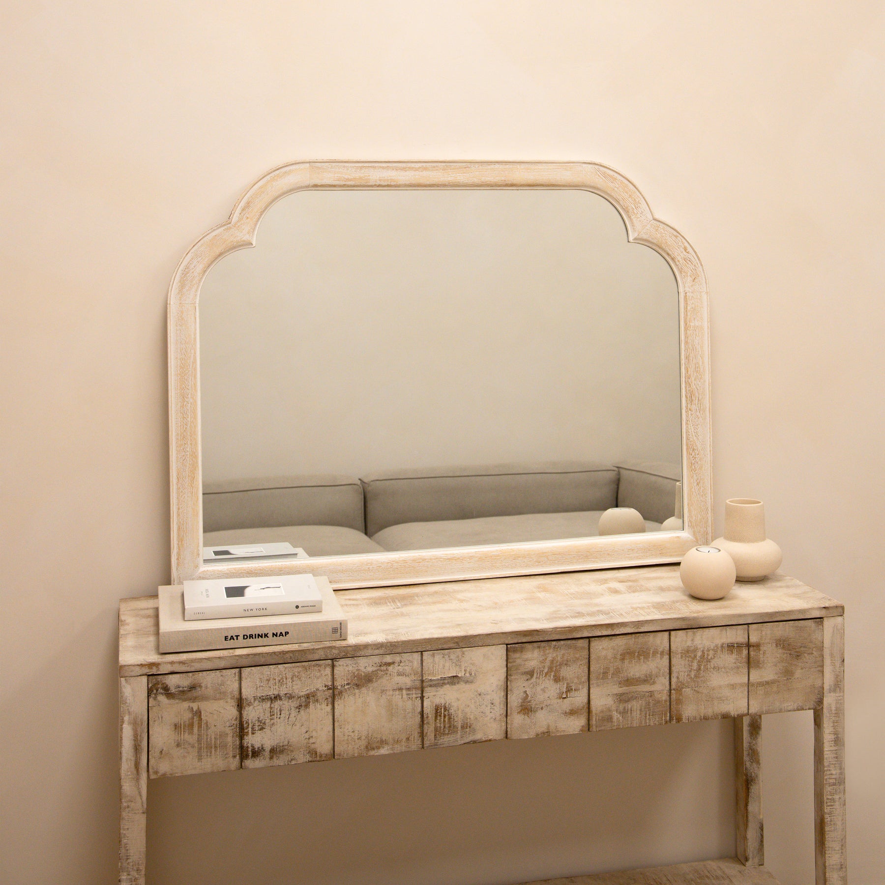 White Washed Wood Arched Overmantle Mirror atop console table