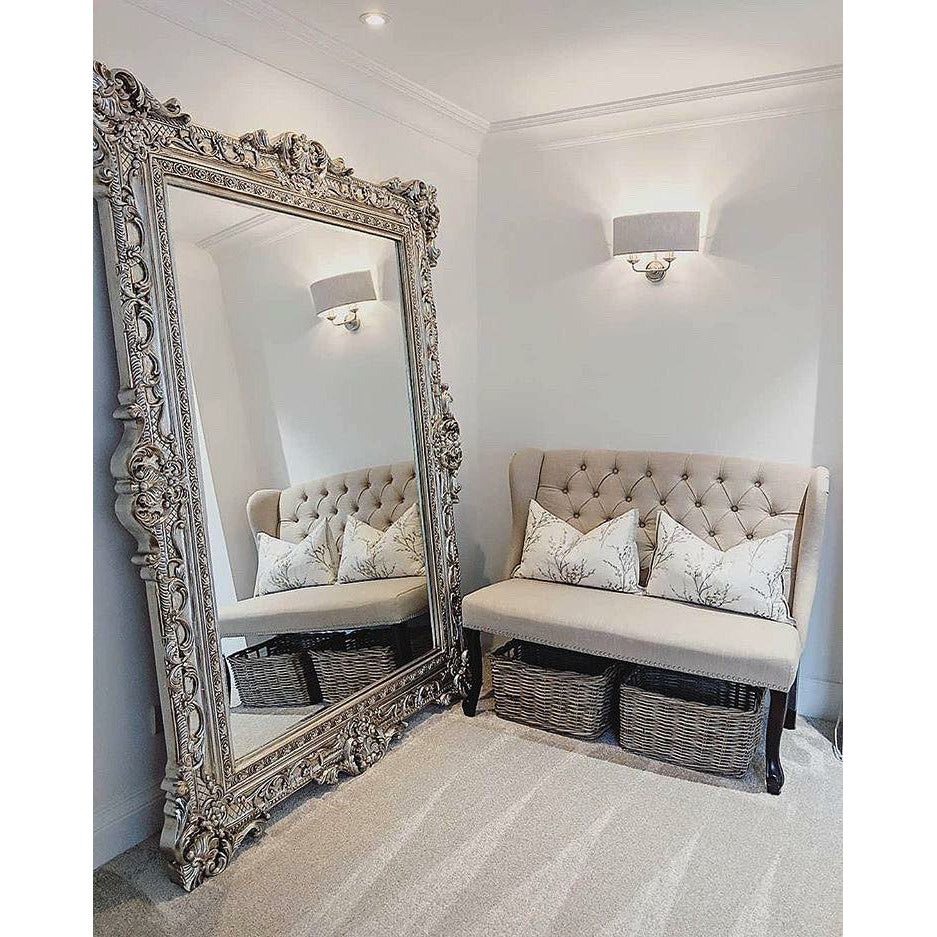 Champagne Ornate Floor Mirror beside chair