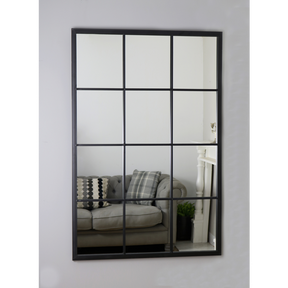 An overall view of this mirror mounted to a wall.