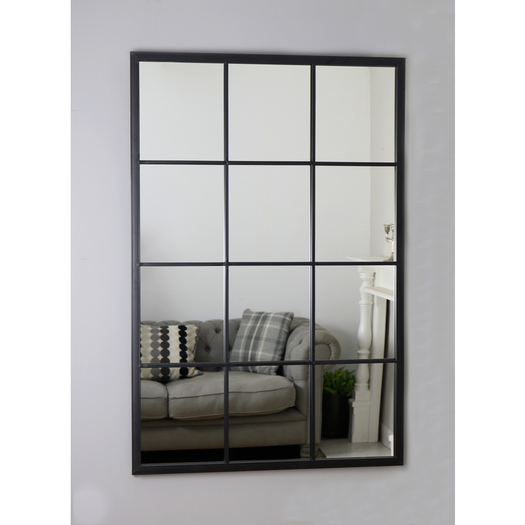 An overall view of this mirror mounted to a wall.