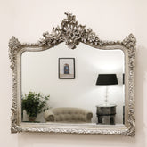 Silver Arched Ornate Overmantle Wall Mirror on wall