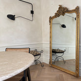 Gold Arched Ornate Full Length Mirror leaning against wall