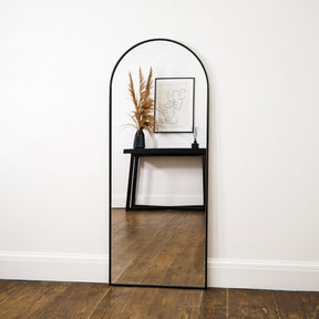 Champagne Full Length Arched Metal Mirror leaning against wall