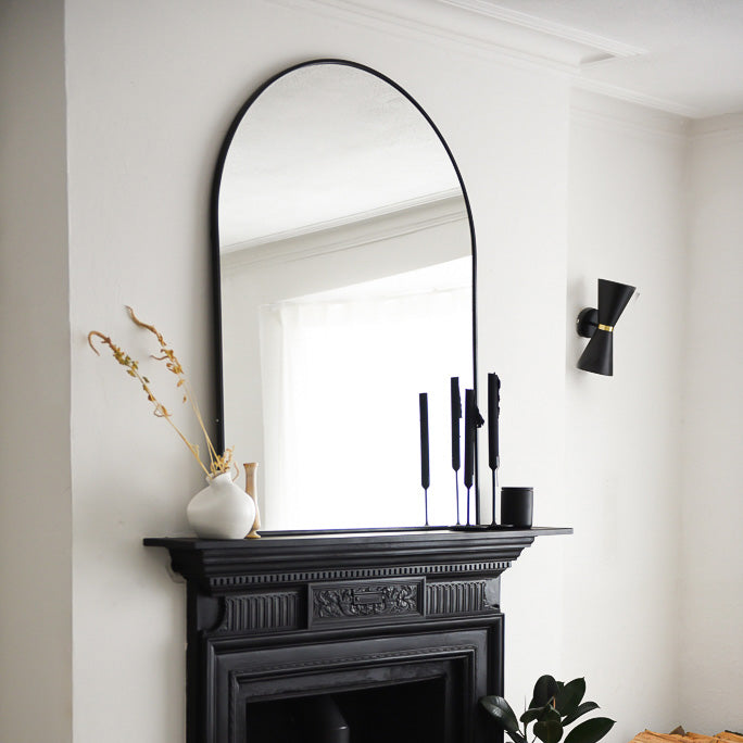 Black Arched Metal Overmantle Mirror above fireplace