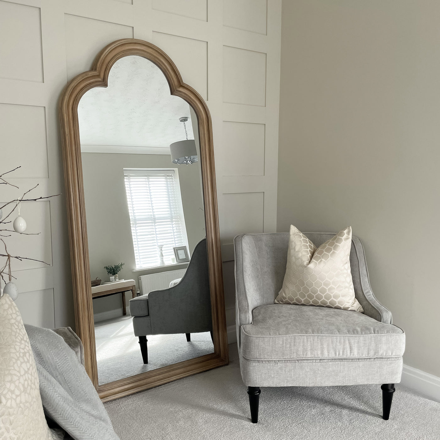 Washed Wood Arched Full Length Mirror leaning against wall