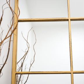 Detail shot of Full length XL gold industrial metal window mirror, emphasis on size