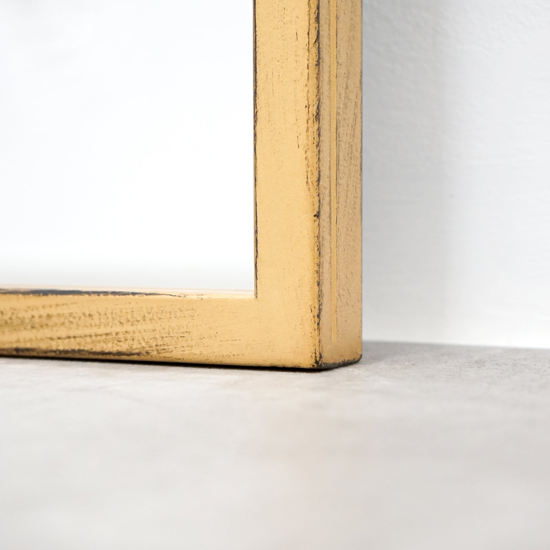 Detail shot of Full length extra large gold industrial metal window mirror corner