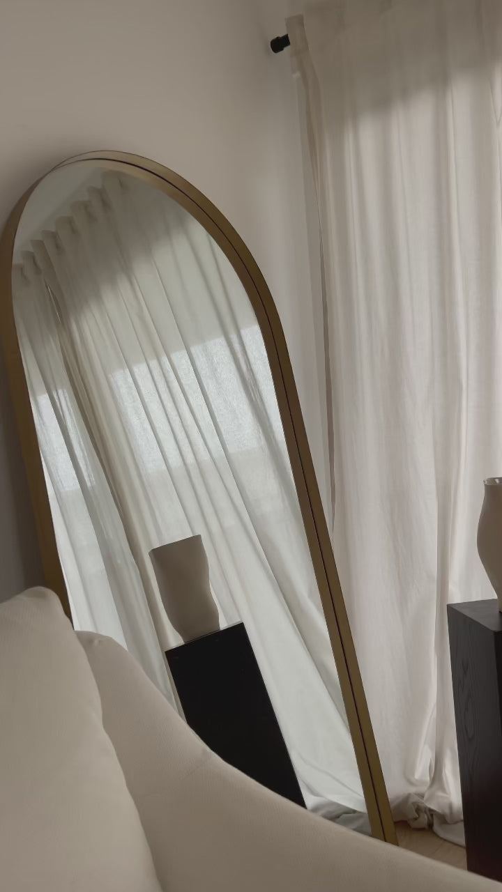 Full length arched gold large metal mirror lean to showcase video